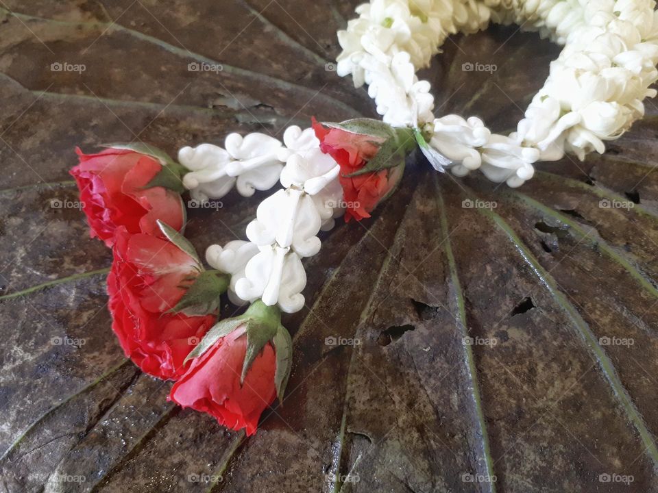 Garland in Thai style isolated on dry lotus leaf