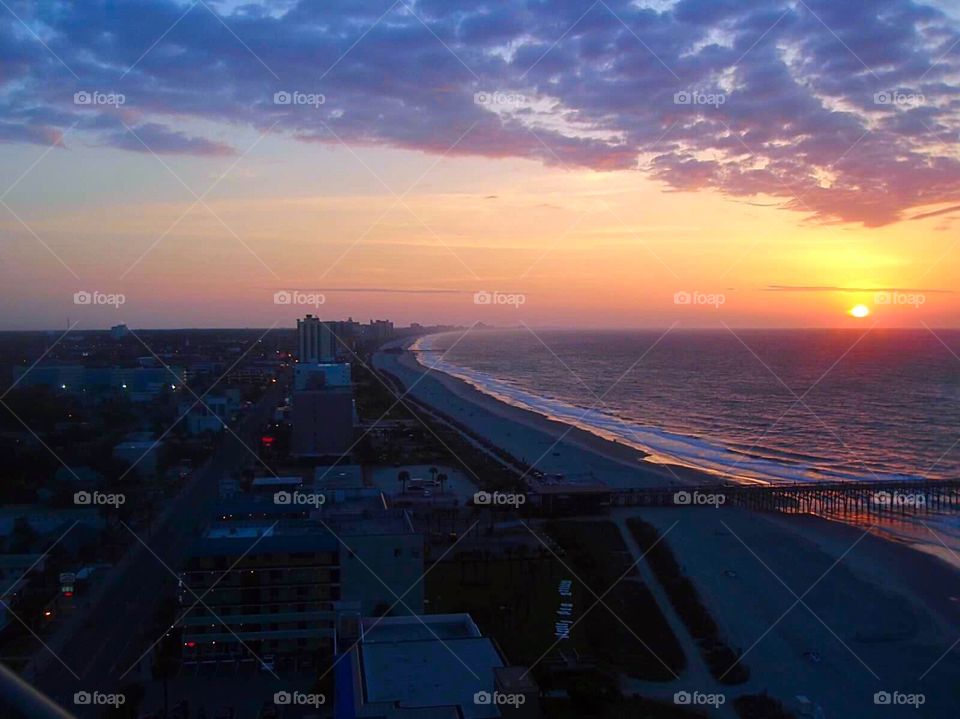 Hotels at Dawn. Strip of hotels along the beach at dawn. 