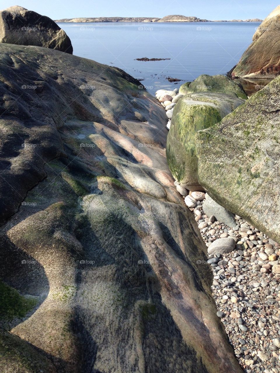 Scenic view of rocks by sea