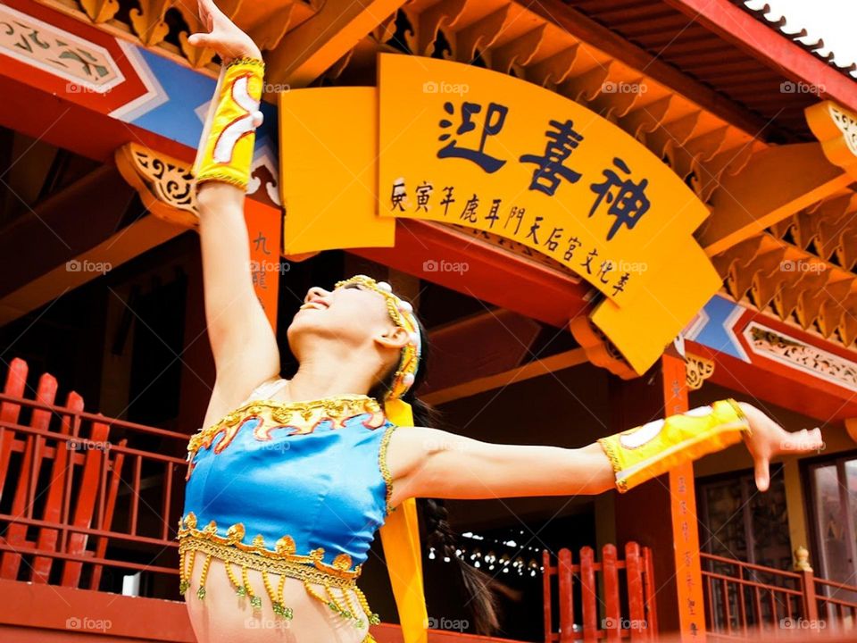 A dancer performs in a temple event