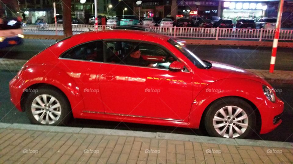 Red car click at street