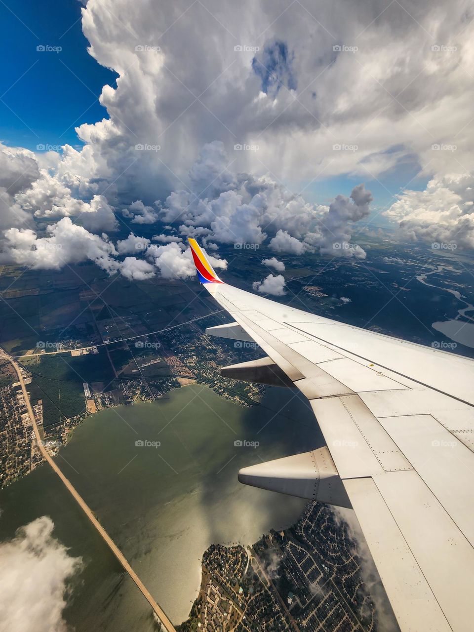 Clouds fill the sky over Houston Texas as a Southwest Airlines 737 descends to land