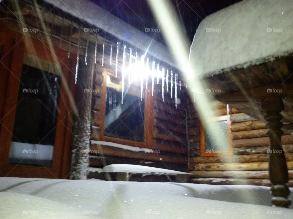 icicle on wooden house. old mountain serbia