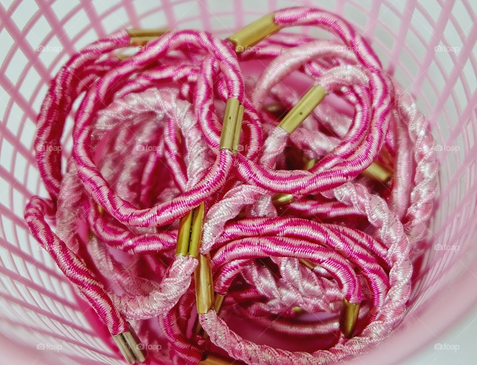 Pink rubber band in the plastic basket