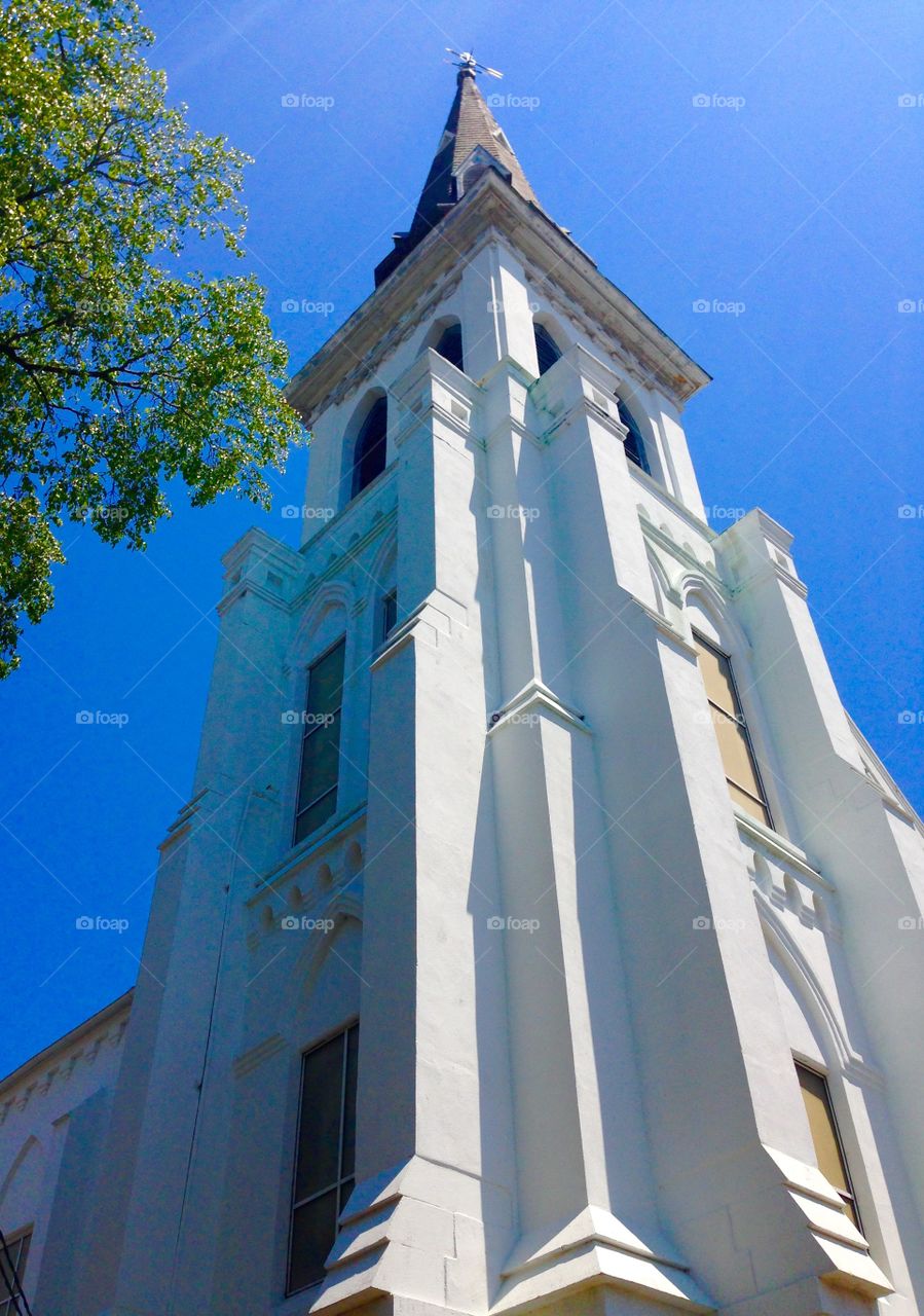 Historic Steeple. The Charleston Emanuel AME Church reaches into a blue summer sky. 
