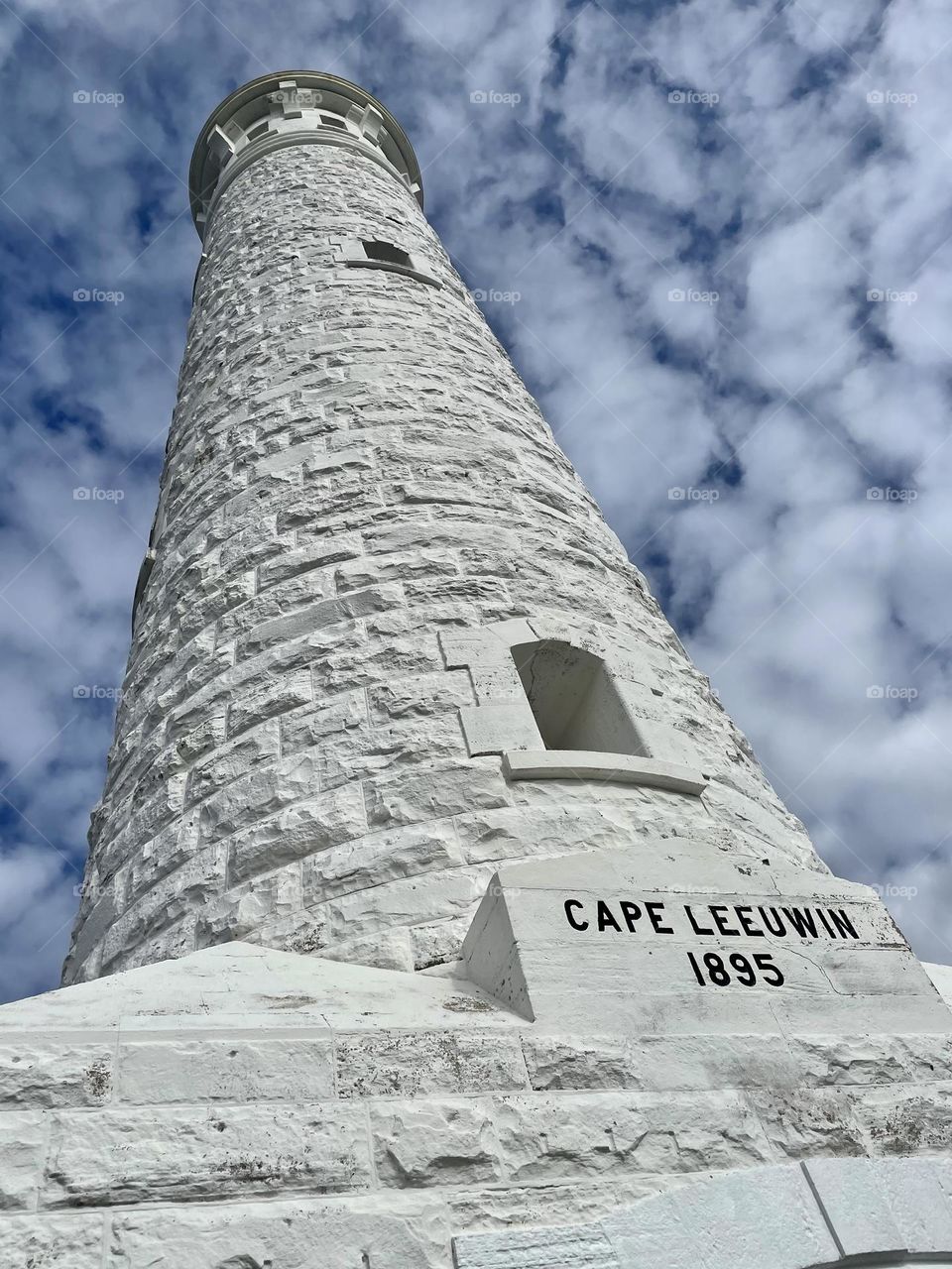 The lighthouse of Cape Leeuwin standing tall into the clouds.