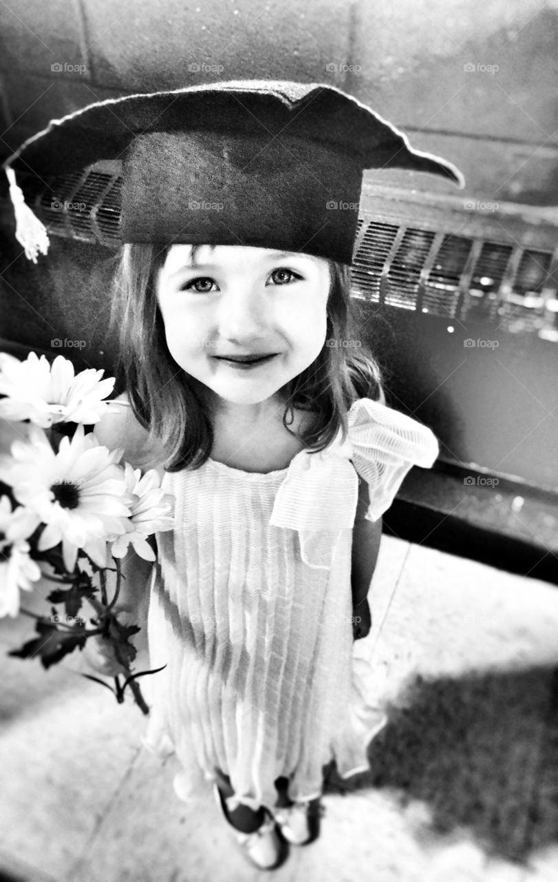 Close-up of cute girl wearing education hat