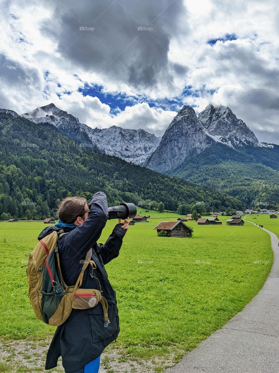 man with the camera in the mountains