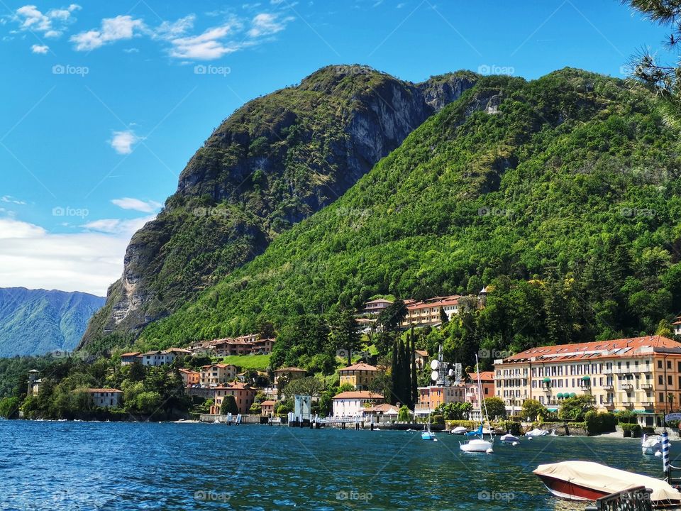 Beautiful view of mountain, sea, blue sky and villages in Menaggio, Lake Como, Italy.