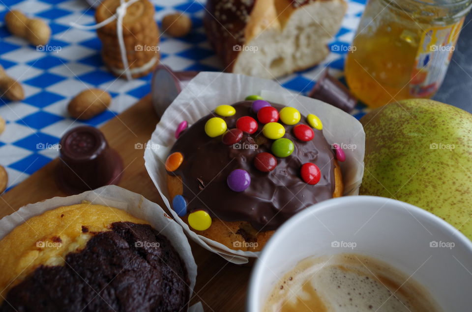 hot coffee with chocolate muffins on vintage background