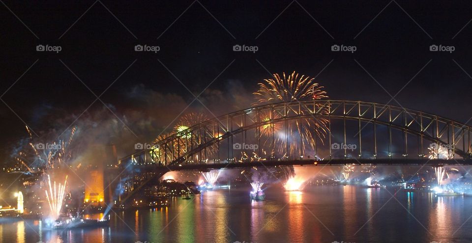 Sydney harbor bridge over parramatta river with firework display
