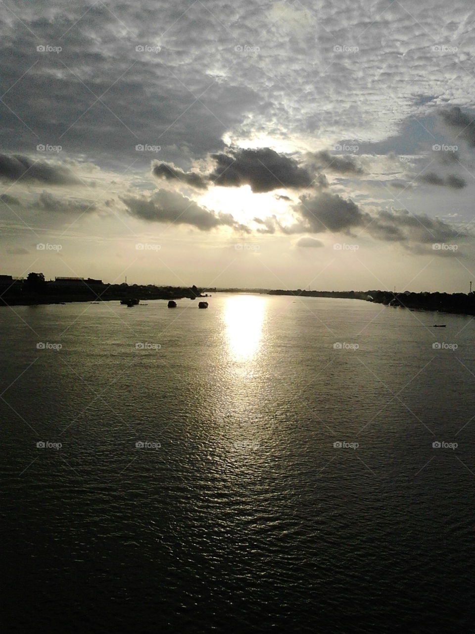 see sunset at the middle of batanghari river