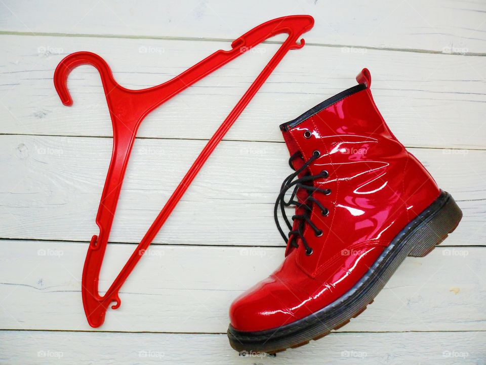 red female shoes and red hanger