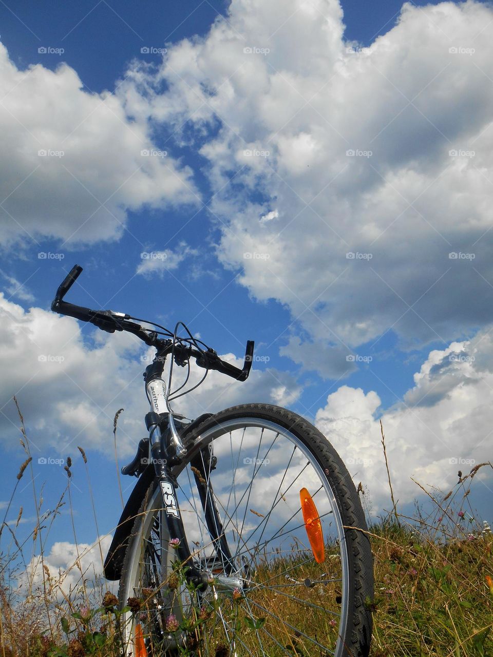 bike on a nature blue sky clouds background lifestyle