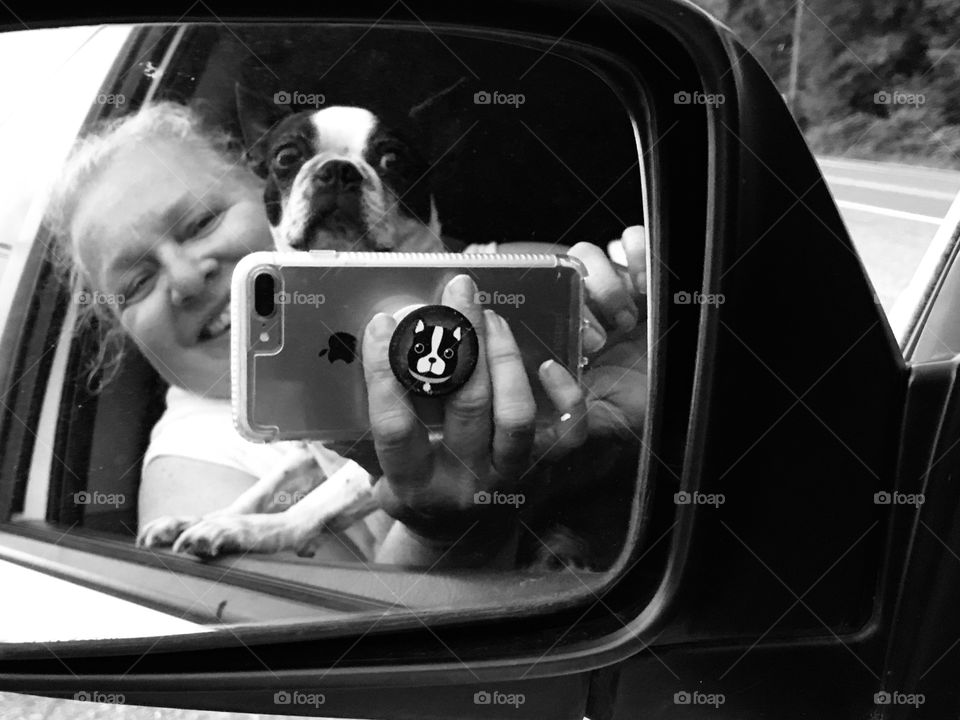 B&W. Having fun taking a photo of my Boston Terrier & I in my side car mirror. She’s got a crazy-eyed look because she was so excited to see what she thought was another dog in the mirror. All that & a Boston Terrier popsocket too!