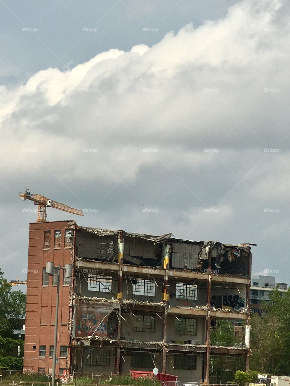 Half demolished old brick apartment house 