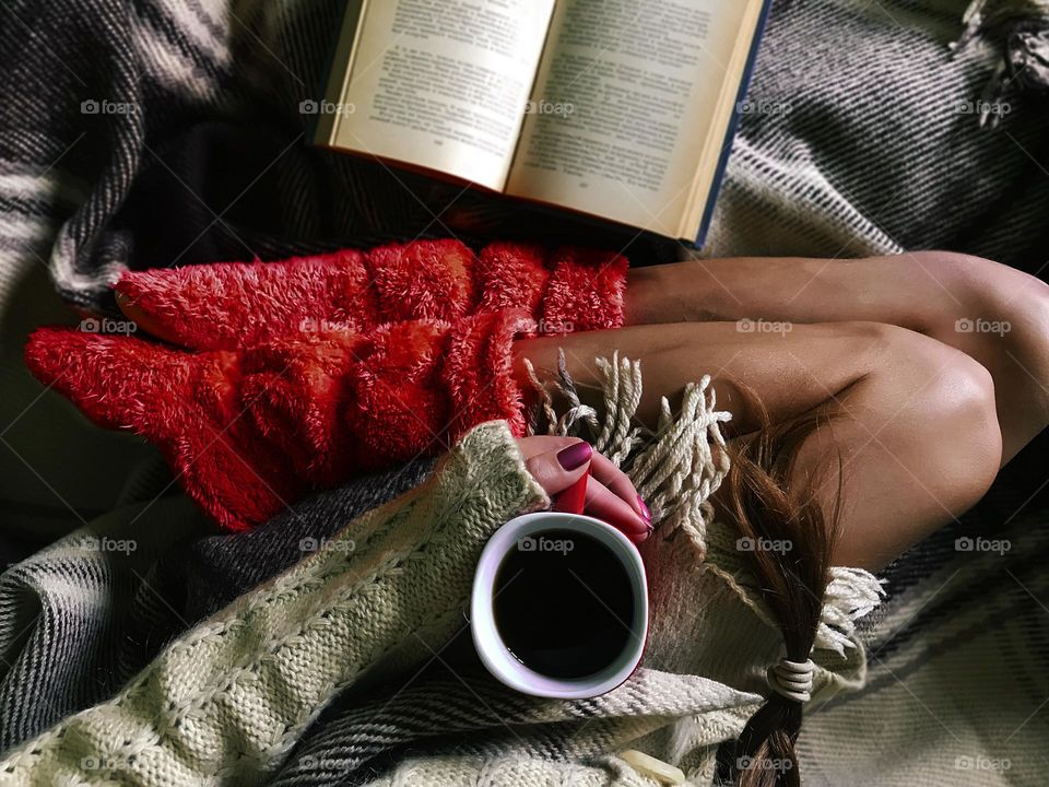 Hot coffee in bed with a book 