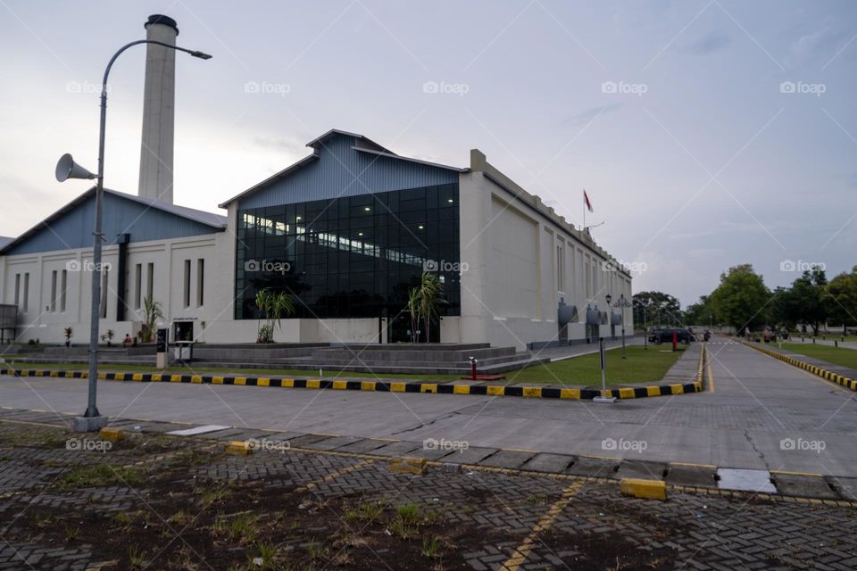 building with yellow and black sriped warning bar around