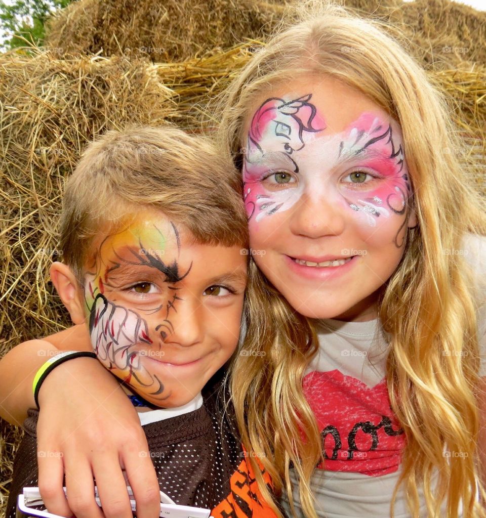 Siblings with face paint