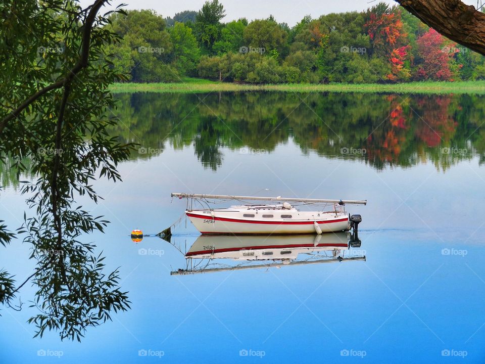 St Lawrence river Boucherville Québec Sailboat reflection