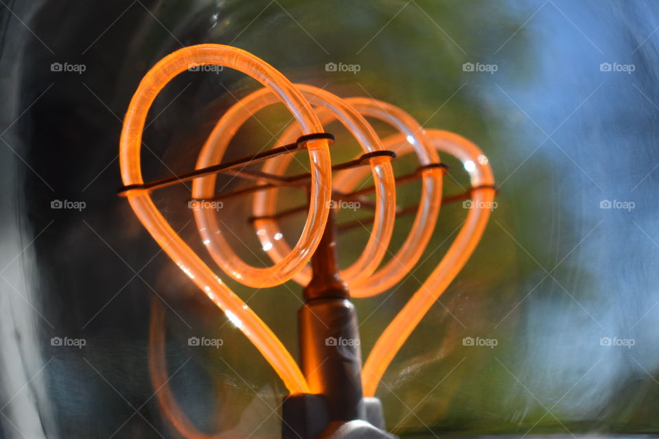 Close-up of orange light bulb