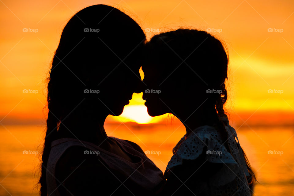 Silhouette of mother and daughter 