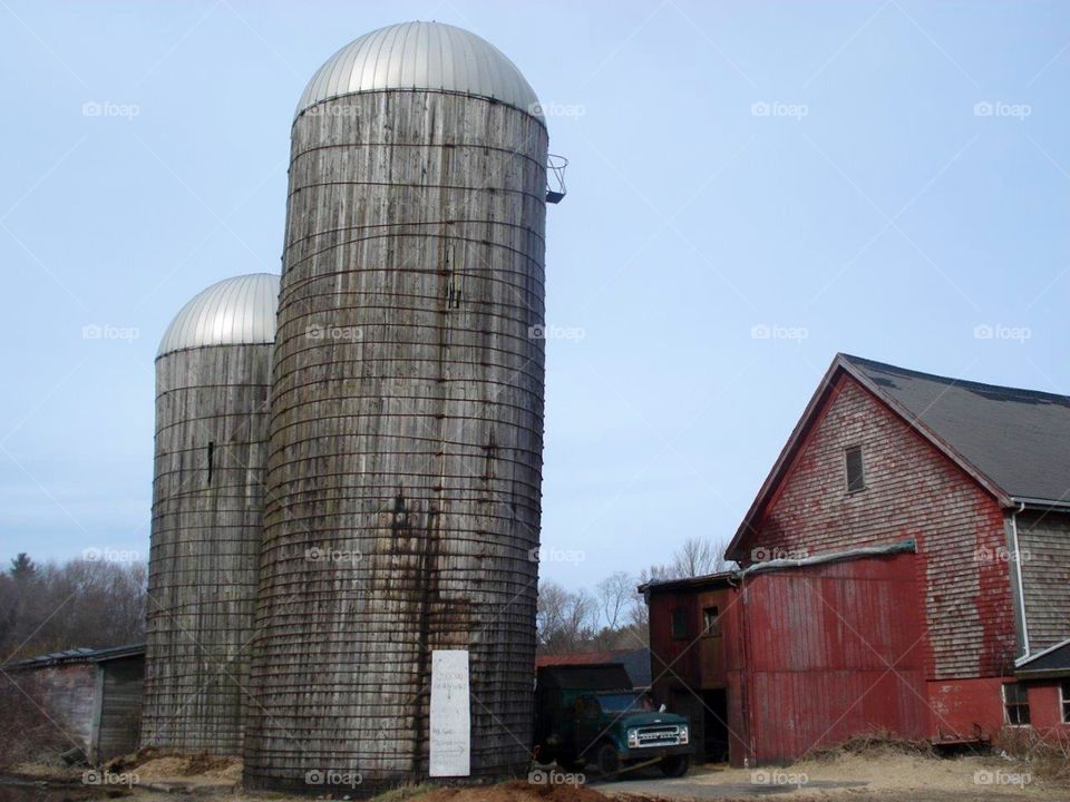 Silos and Old Barn seen as we were riding through a New England area. Beautiful sky, fields, overgrown fences. Very nice summer day.