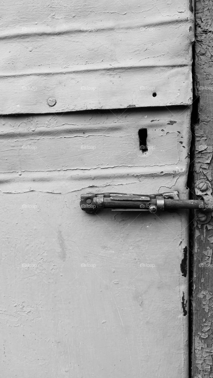 keyhole and bolt, bolt, closed old door, black and white photo, minimalism, vintage
