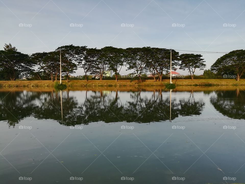 Reflection on the lake in the cloudy day morning.