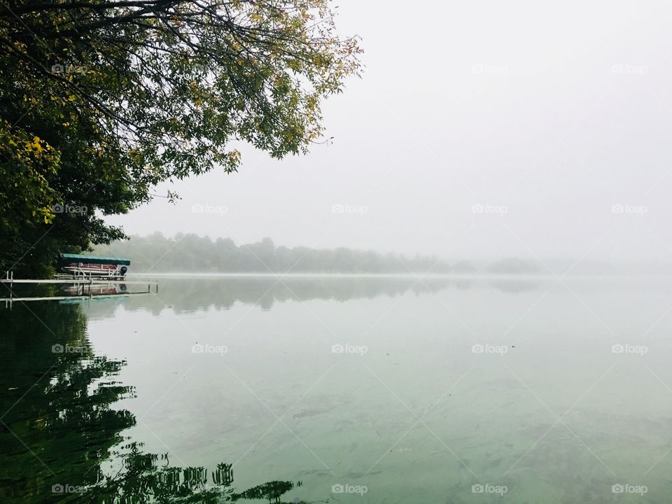 Boat storage - Boat docked - foggy Wisconsin morning on Lake Tainter - USA