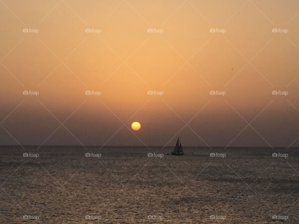 Sailing boat at sunset