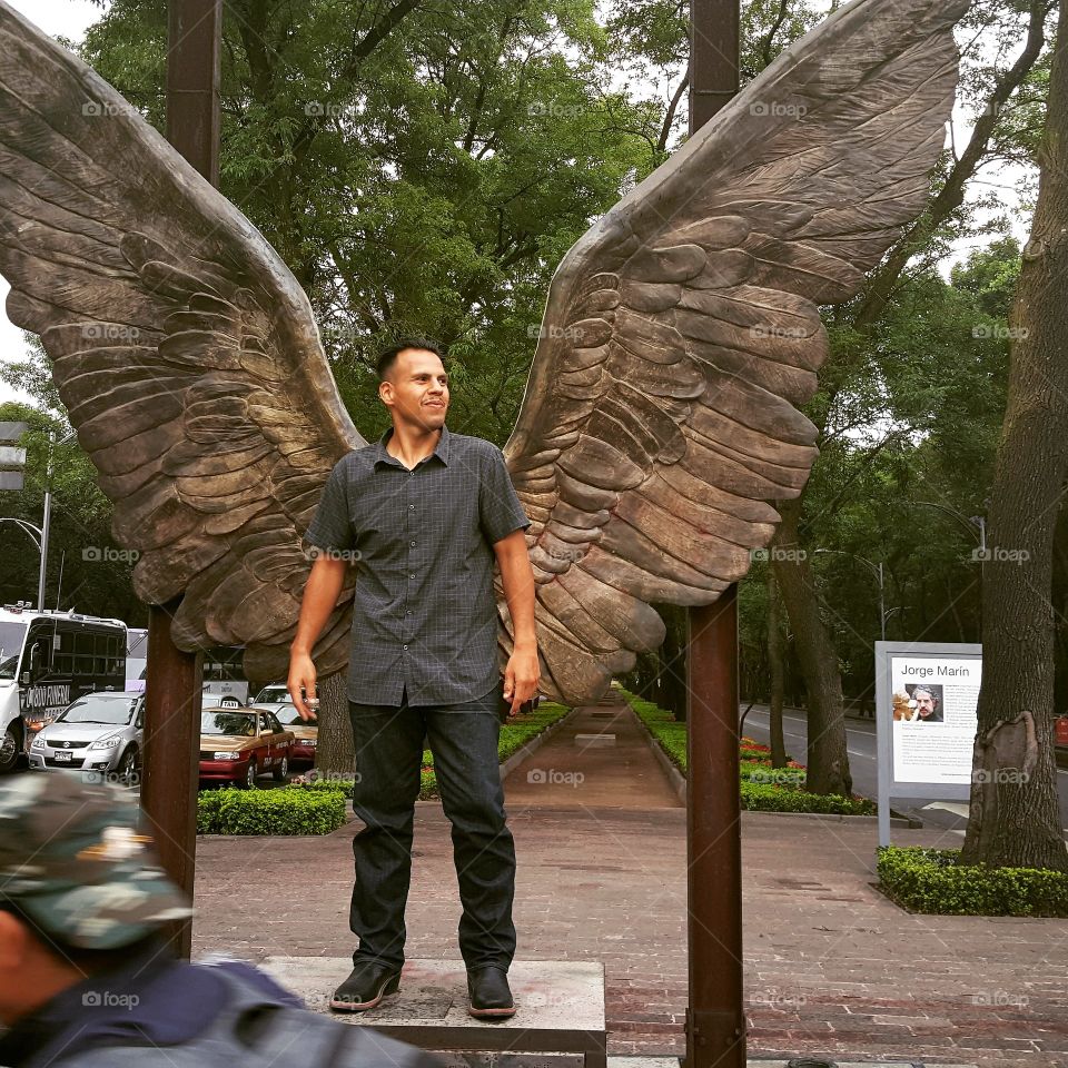 Man with wings on Mexico sculpture