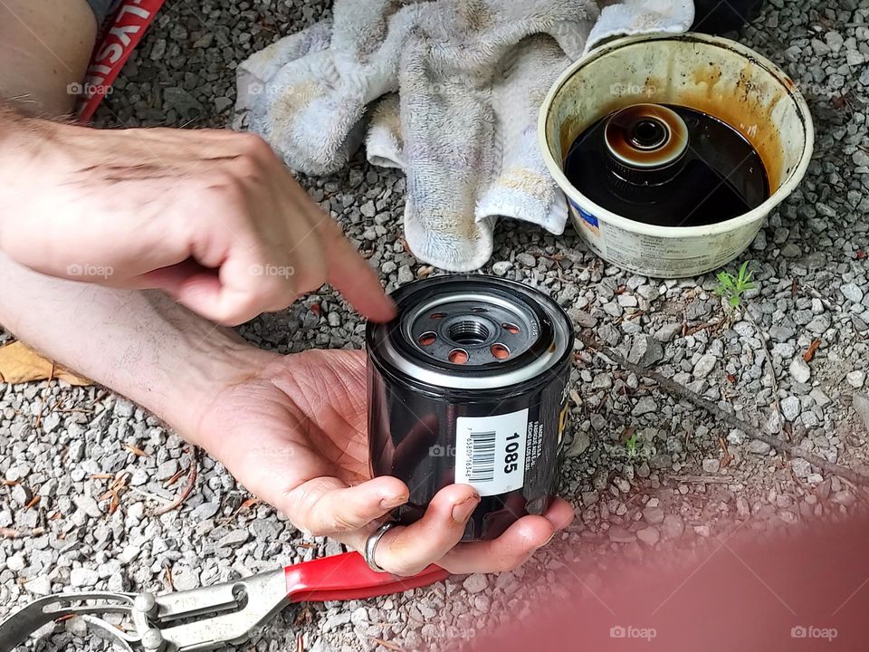 adding some oil to the seal on the oil filter before installing it