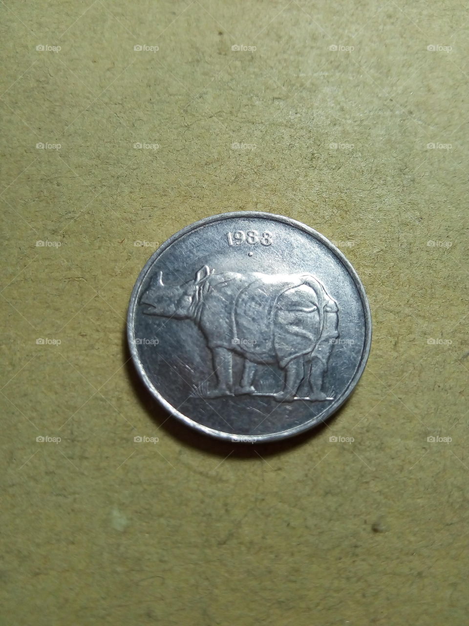 A coin of twenty five paise- 1/4 share of Indian Rupee issued by Government of India in 1988.