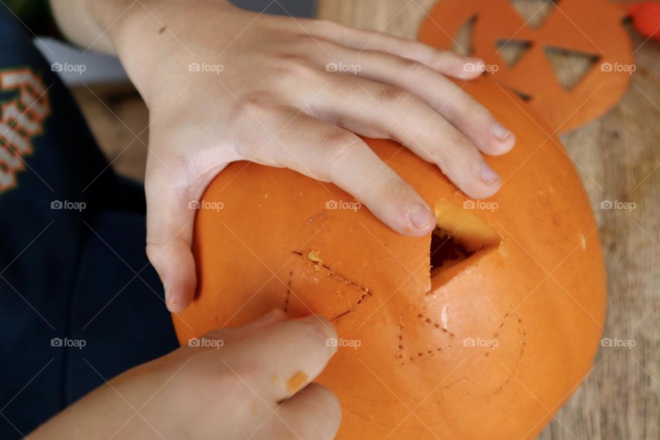 Carving Halloween pumpkin 