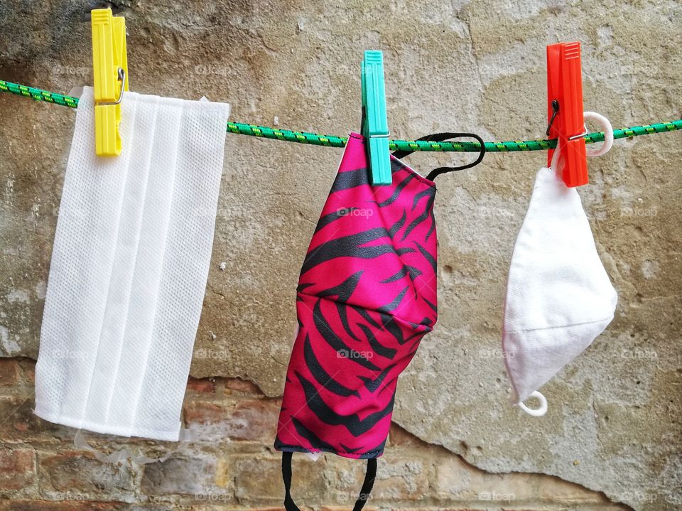 Recyclable cloth masks, washed and left to dry in the wind