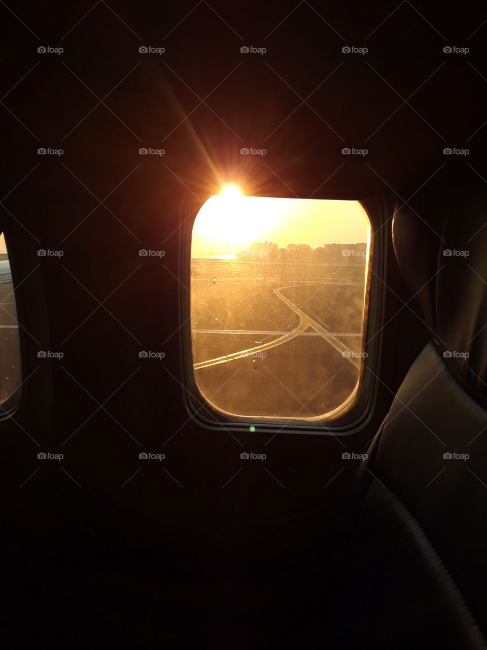 Sunrise through airplane window 