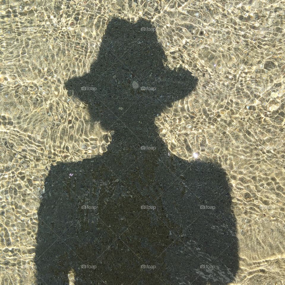 Reflection of myself in the water from the island of Ios in Greece