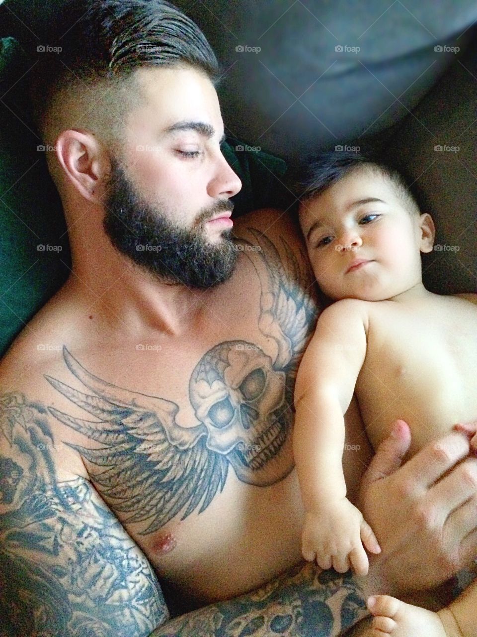 Baby snuggles with daddy