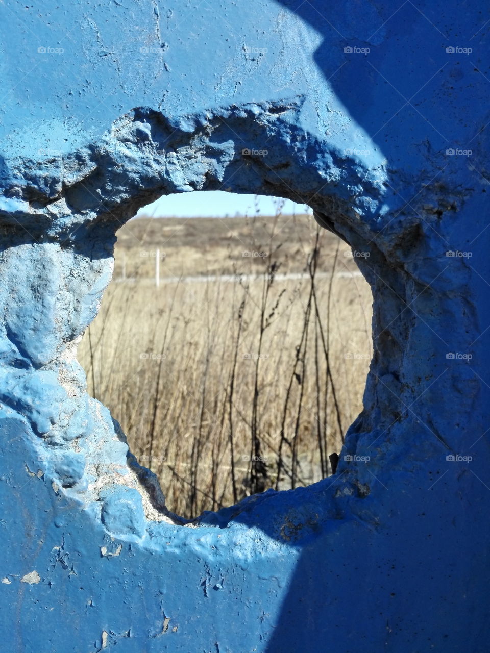 The hole in blue wall