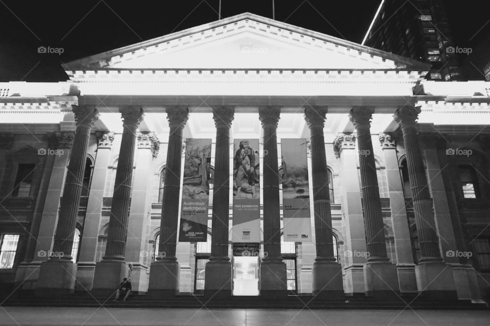 Melbourne Art Gallery. Melbourne Art gallery lit up at night. Columns illuminated from behind. 