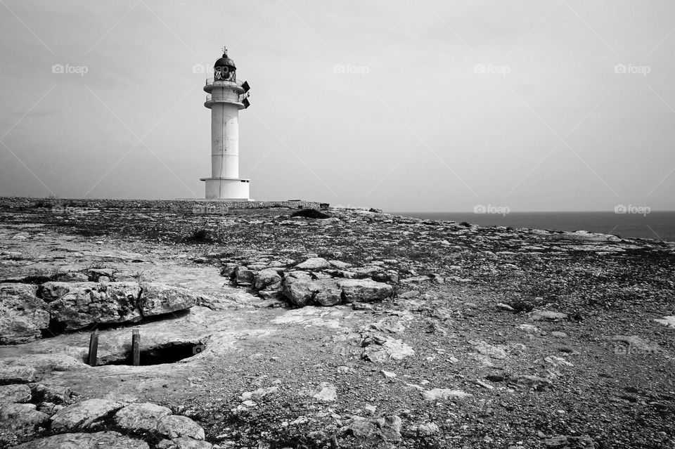 The drama of Far de la Mola, cliff-top lighthouse, on the island of Formentera, Spain