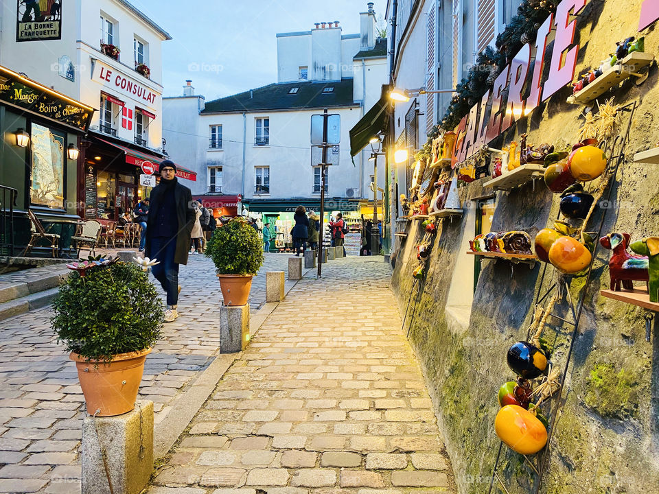 A street in Montmartre in Paris France with pottery on the wall