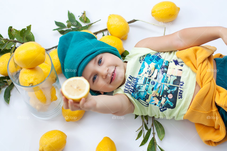 boy with lemons