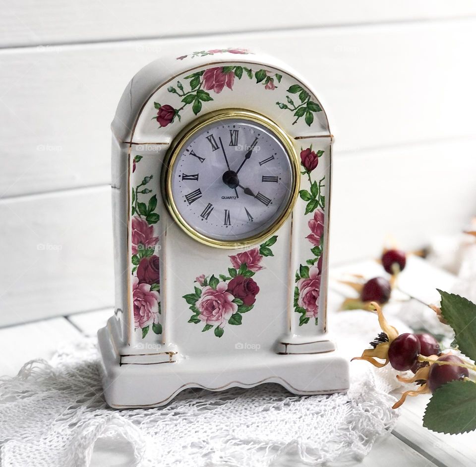 Old porcelain table clock won’t floral ornament