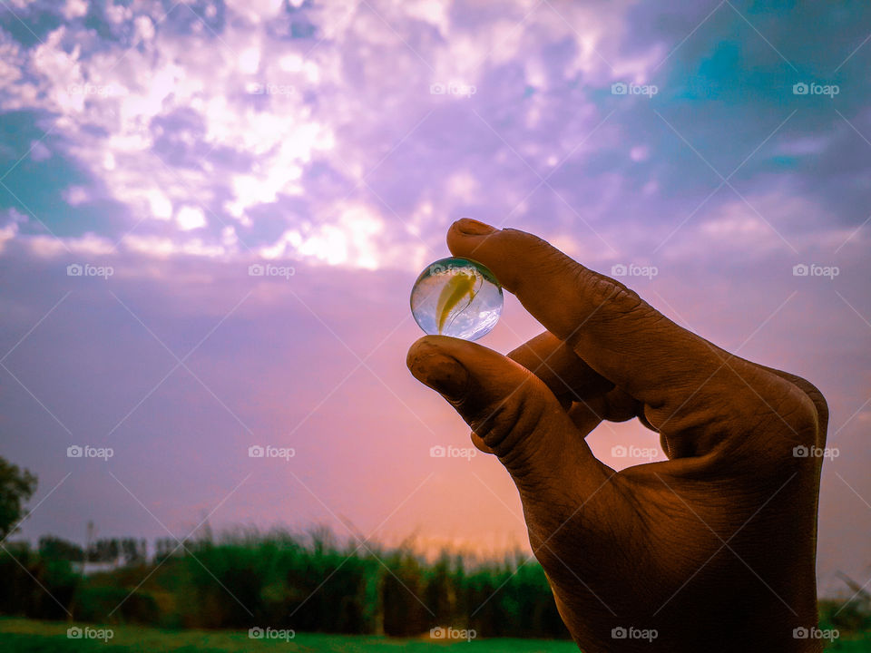 This Photographs I clicked the sun while drowning. In this photo, holding a small stone in one hand
width:4128
Height:3096
File size:3.36MB
Maker: Samsung 
Model:SM-M10SF
FocalLenght:3.6MM

Profile Link: https://foap.com/users/arun.kumar5