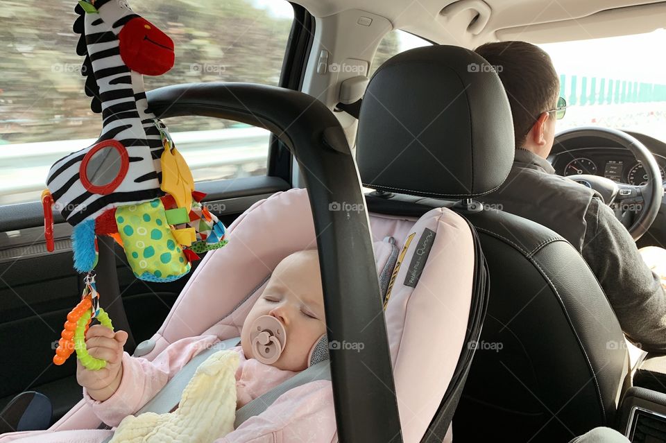 Road trip, baby sleeping in chair in car