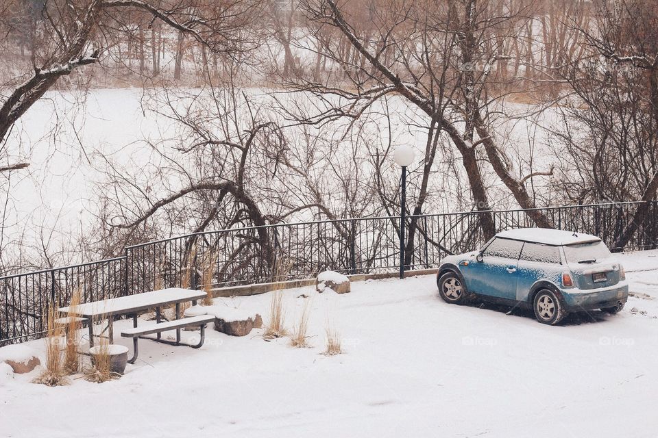 Car parked near frozen lake!