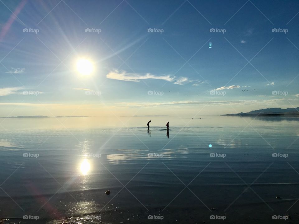 Shallow great Salt Lake. Utah. Boys in the water. Beautiful sunset. Perfect vacation. Beauty all around.