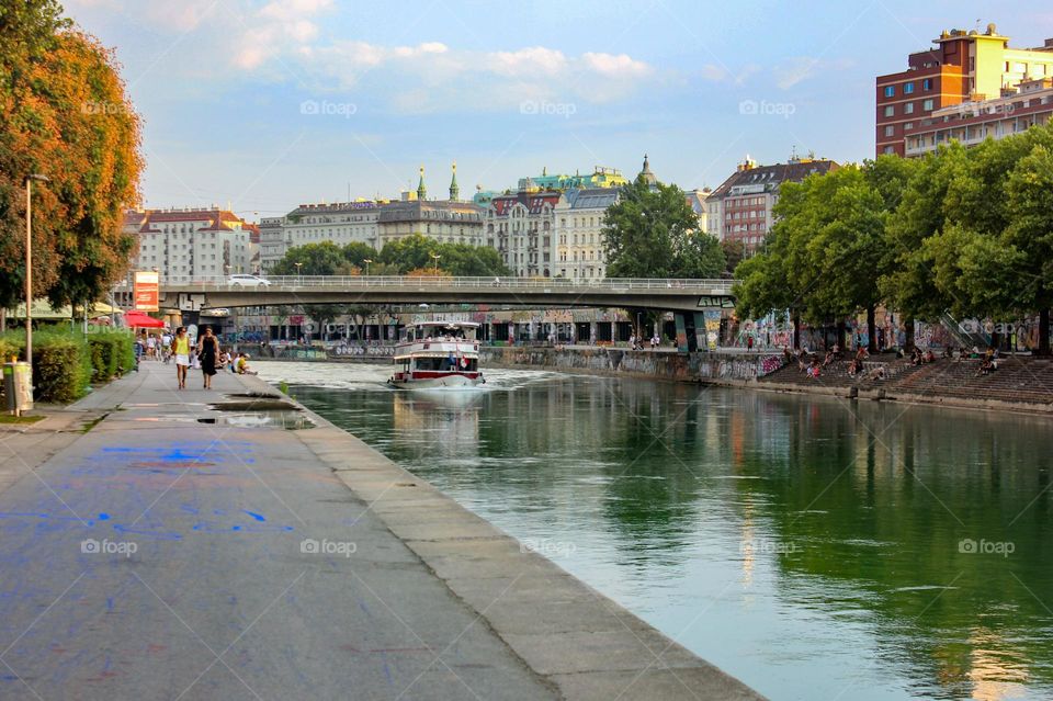 A ship sails down the Danube on a summer evening